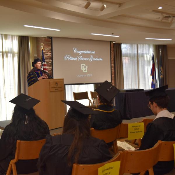 Associate Chair giving graduation speech