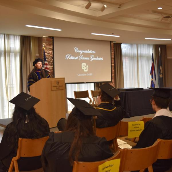 Associate Chair giving graduation speech