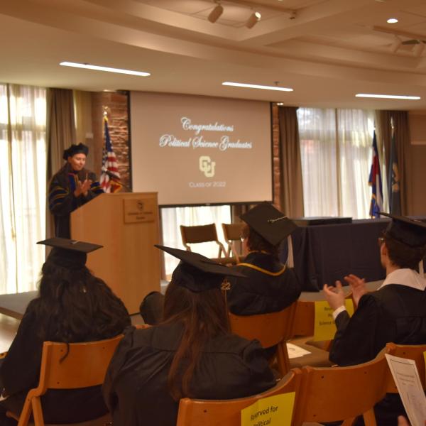Associate Chair giving graduation speech