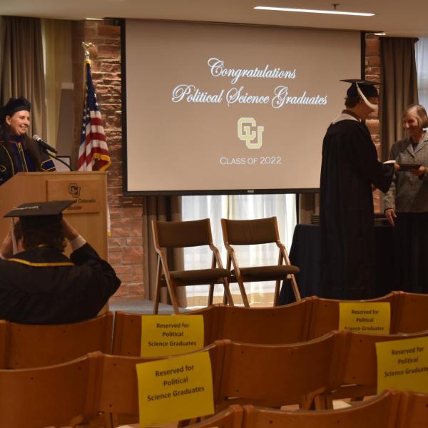 Student accepting diploma