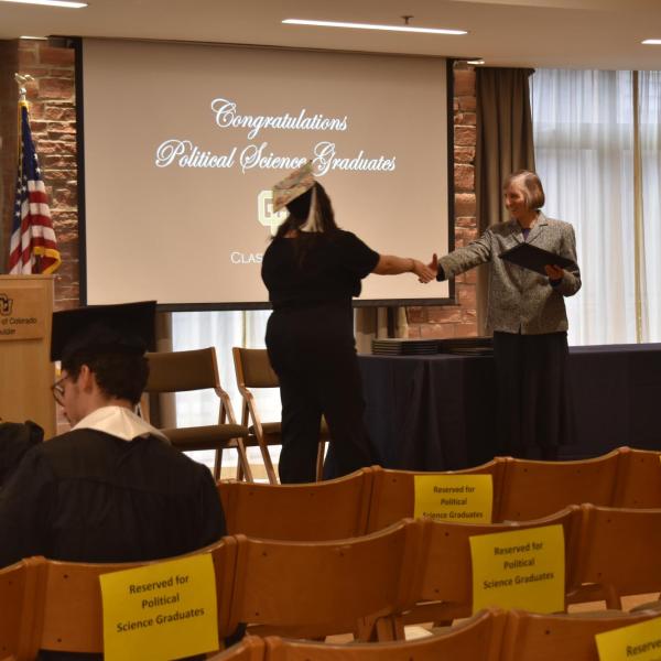Student accepting diploma