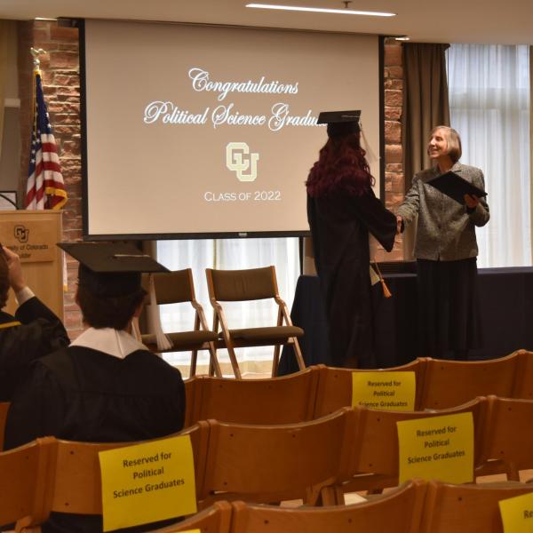 Student accepting diploma