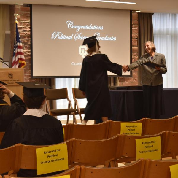 Student accepting diploma