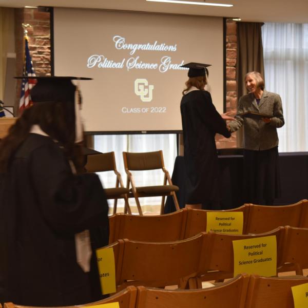 Student accepting diploma