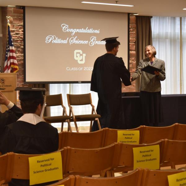 Student accepting diploma