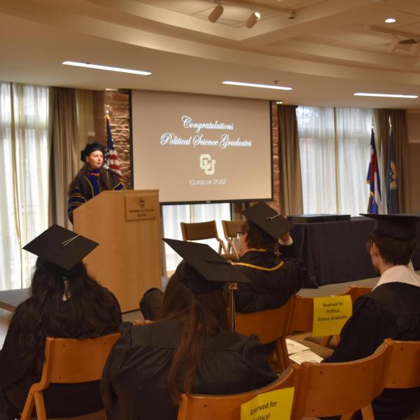 Associate Chair giving graduation speech