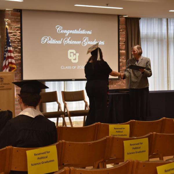 Student accepting diploma