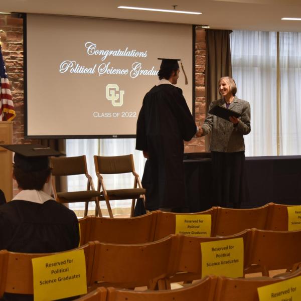 Student accepting diploma