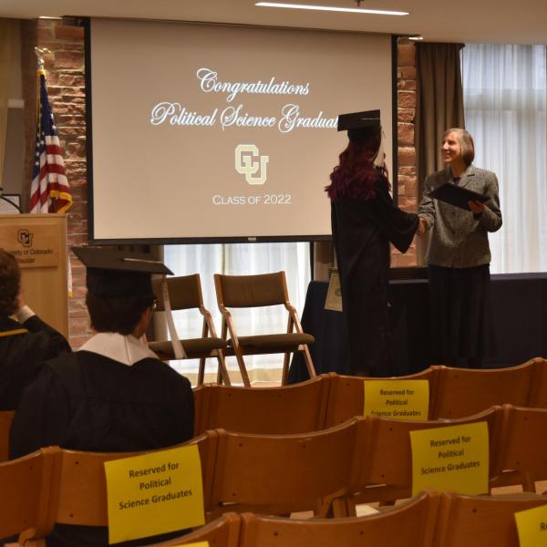 Student accepting diploma