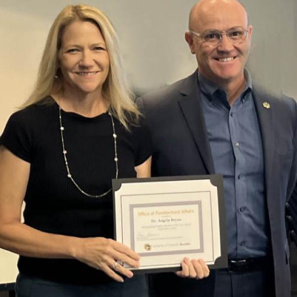 Dr. Angela Bryan (Psychology/Neuroscience) and Dr. Massimo Ruzzene, Vice Chancellor for Research and Innovation and Dean of the Institutes