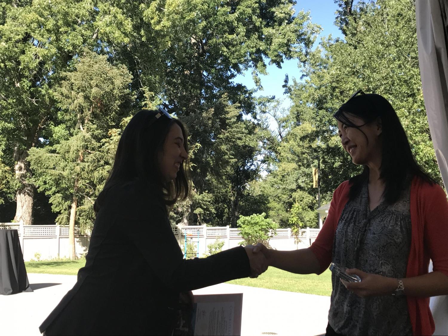 Julienne Ng Recieving Outstanding Postdoc Award
