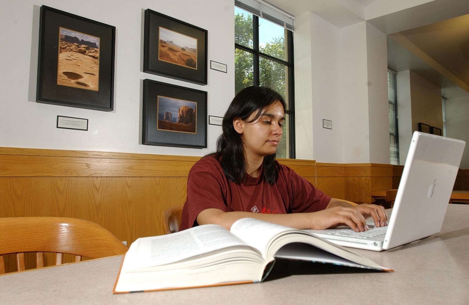 Woman typing on a computer