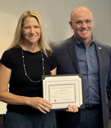 Dr. Angela Bryan (Psychology/Neuroscience) and Dr. Massimo Ruzzene, Vice Chancellor for Research and Innovation and Dean of the Institutes