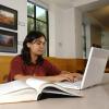 Woman typing on a computer