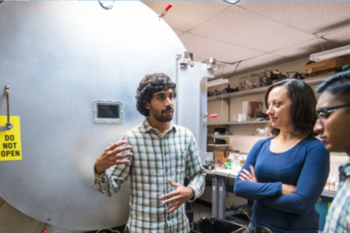 a grad student explaining what's happening in the lab