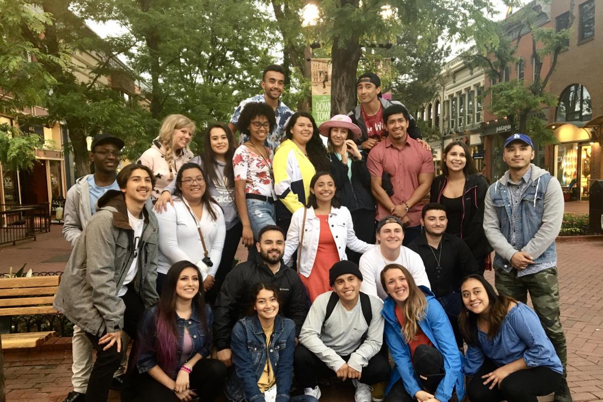 a group of students gathered together on Pearl Street Mall