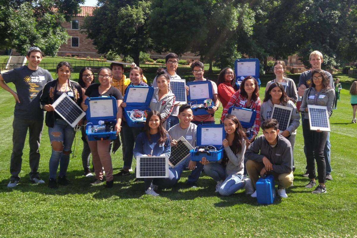stem program participants with the solar suitcases they built