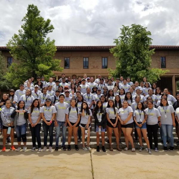 a large group of CUUB students standing on steps