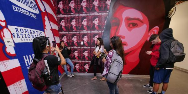 students viewing the indigenous mural space in the visual arts complex on cu boulder campus