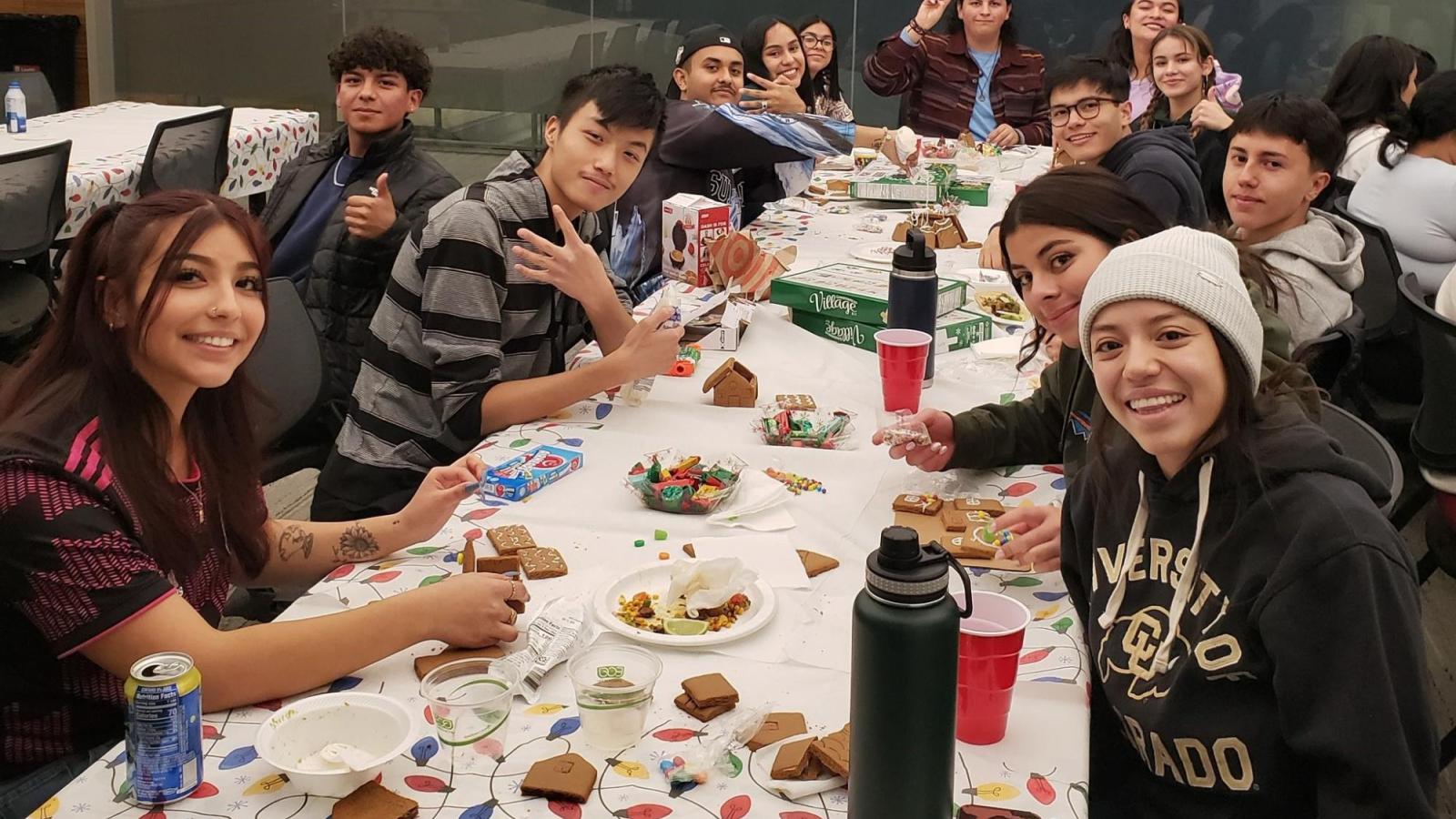 Precollege students eating together.