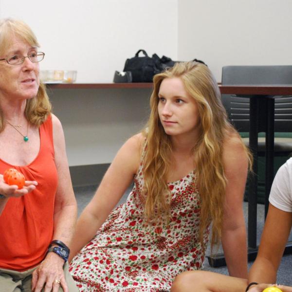 Left: SASC Program Coordinator Karen Wyatt during Academic Skills I. Right: Anna Ritz. Using ball game to teach about balance between work, school, etc.