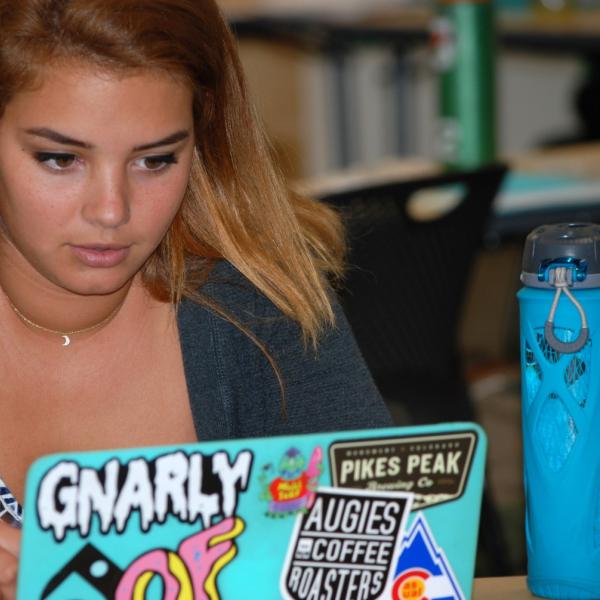 Kayla Williams works on the BudgetBuffs package. (Photo by Murray Meetze/University of Colorado)
