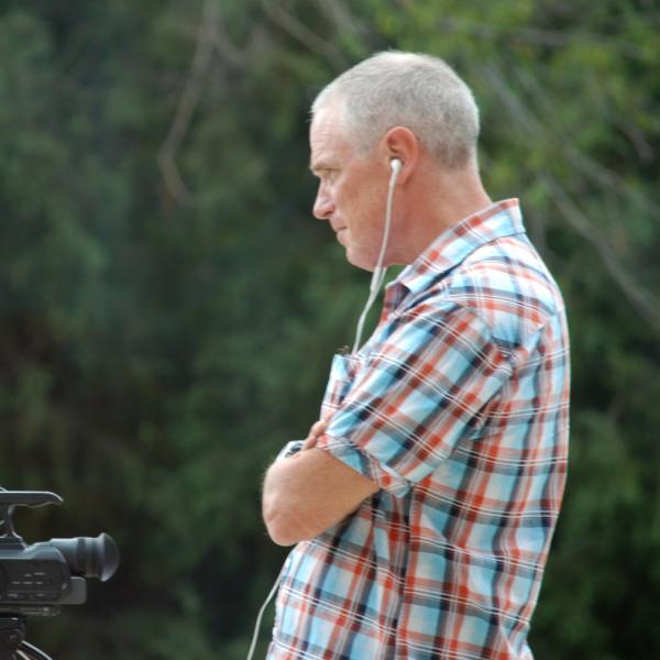 Jeff Browne monitors an interview with Beit Gorski by Team Ally. (Photo by Murray Meetze/University of Colorado)