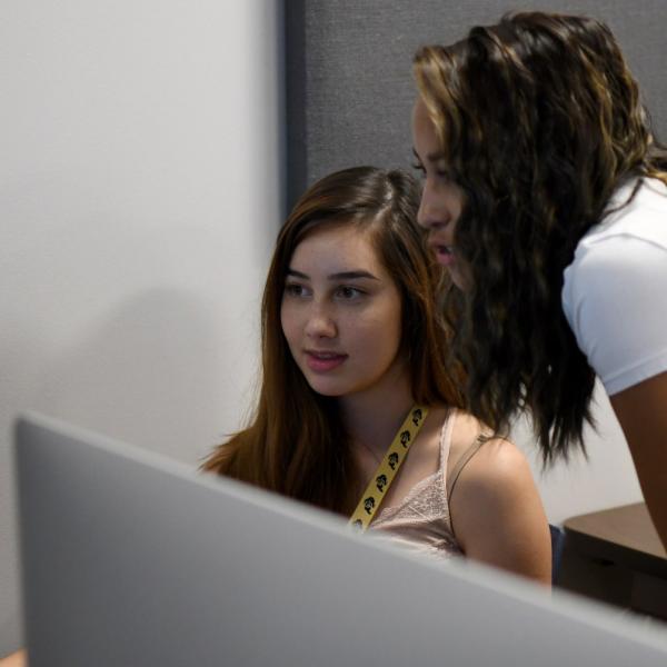Nina Ryan works on an augmented reality project with teaching assistant Aabriti Shrestha during a course for critical media practices.