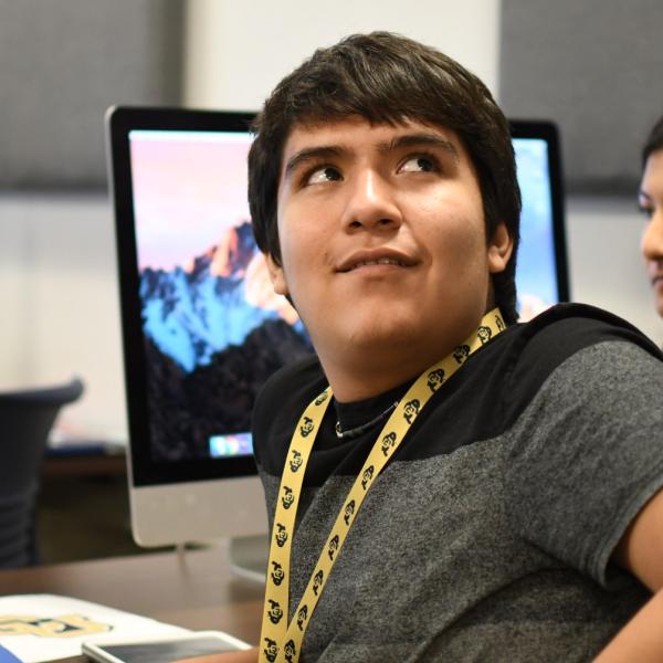 Josh Bustillos listens to Eric Coombs during a DCMP session.