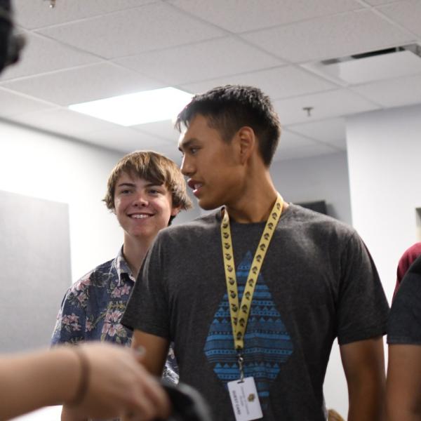 Conner Davis watches his classmate, Bre Taylor, use a virtual reality headset.