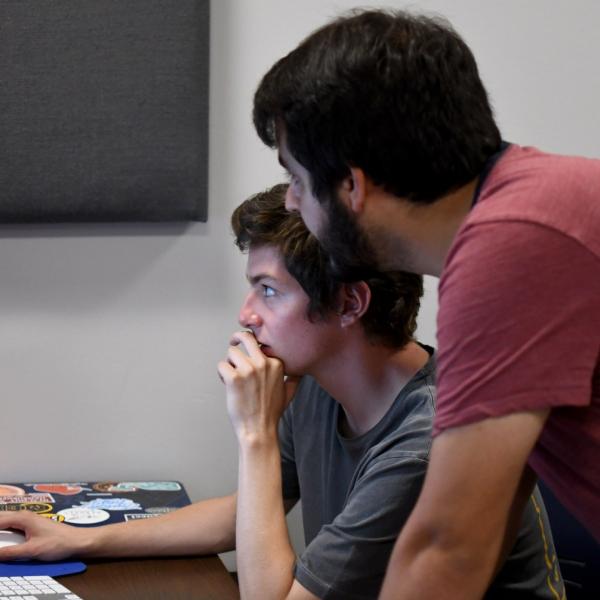 Stephen Callcott works on an augmented reality project with Eric Coombs during a course for critical media practices.