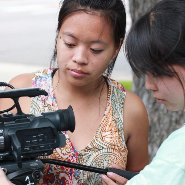 Marissa Kelley and Kristin Jihye Oh playing with video camera during Broadcast I session