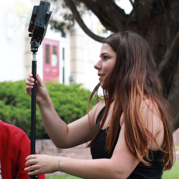 Nathaniel Nash and Rachel Boyce play with light stand during Broadcast I
