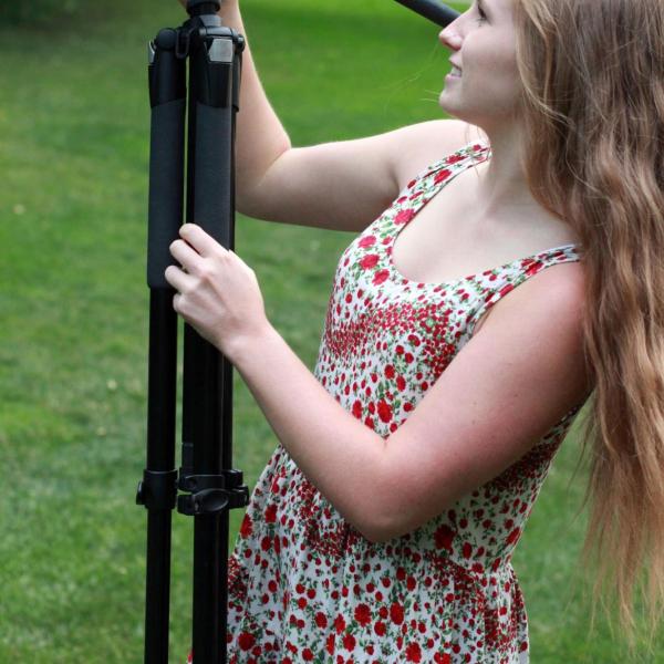 Anna Ritz setting up tripod for camera stand