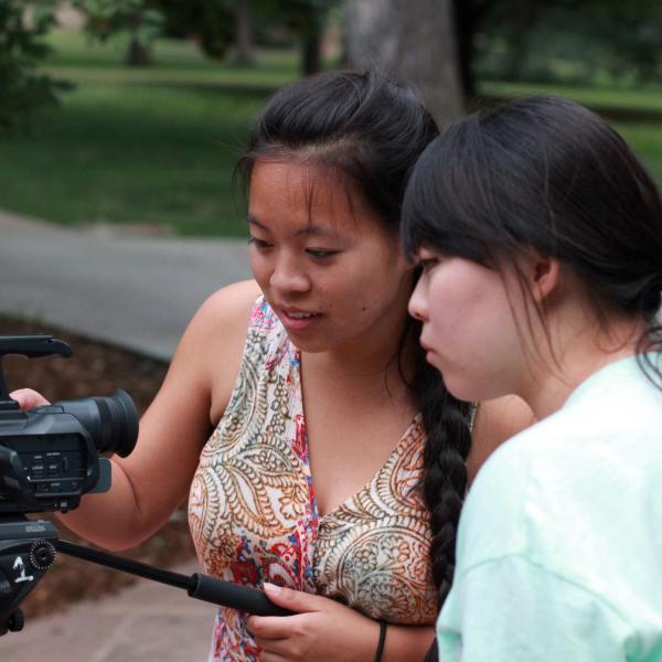 Marissa Kelley and Kristin Jihye Oh playing with video camera during Broadcast I session