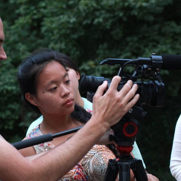 Professor Gino Canella works with Marissa Kelley to shoot B roll during the Broadcast I session.