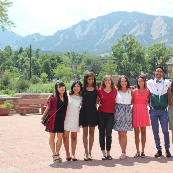 Intensive members pose for a group picture in front of the Flatirons