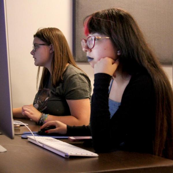Bella Liffick and Alondra Carlos-Ferrales work on a project in a critical media practices class.