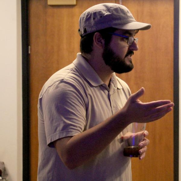 Instruction Eric Coombs talks to students during a session on critical media practices.