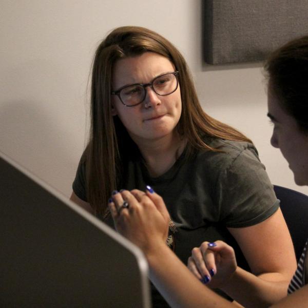 Emma Baziuk and Bella Liffick talk about their project during a DCMP course.