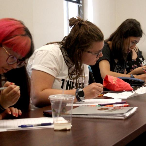 Bella Liffick takes notes during class.