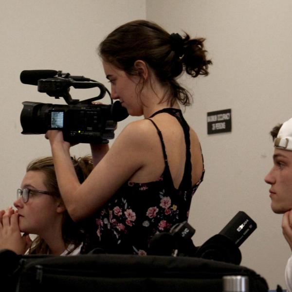 Emma Baziuk practices shooting with her camera before heading outside to take video.
