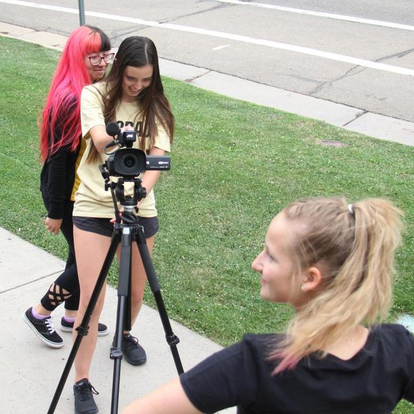 Lauren Irwin takes footage of Devon Goodwin.