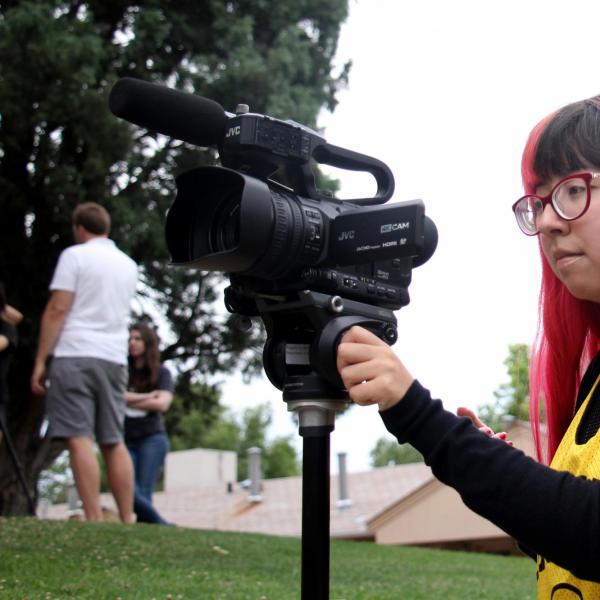 Alondra Carlos-Ferrales shoots video outside during class.