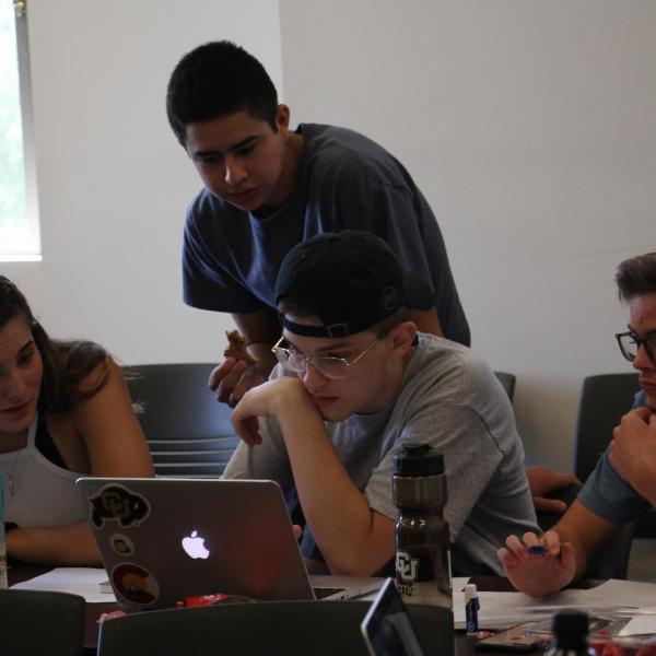 Bobby Berry lays out an outline with his classmates.