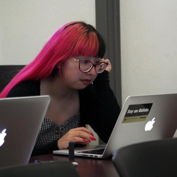 Alondra Carlos-Ferrales takes notes during class.