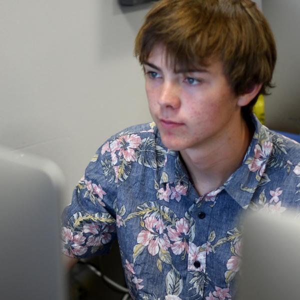 Conner Davis works on an augmented reality project during a course for critical media practices.