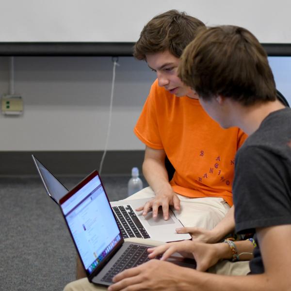 Stephen Callcott and Conner Davis work together on an assignment for a writing session.