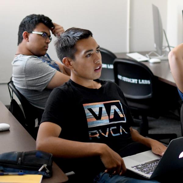 Austin Mann listens to his team members during the first team meeting.