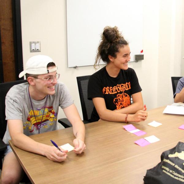 Bobby Berry (left), Katia Kanner (middle left), Jorge Quinones (middle right) and Nic Lawrence discuss during an information science activity.